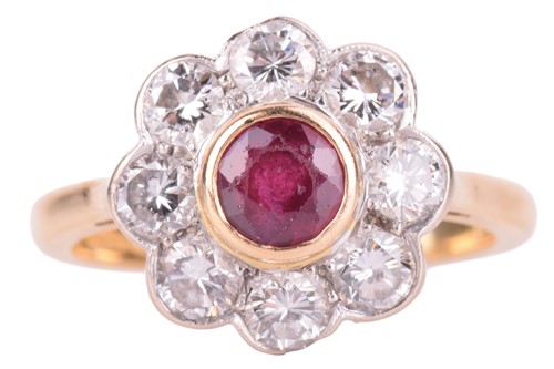 Lot 105 - A ruby and diamond cluster ring set in 18ct...