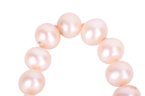 Lot 12 - A single-strand cultured pearl necklace with a...