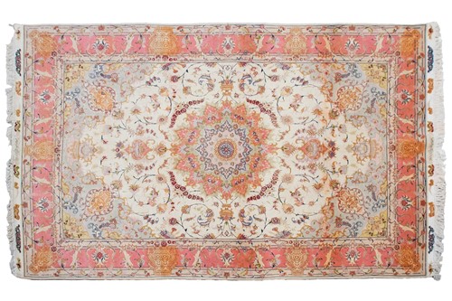 Lot 191 - A cream ground machine woven Tabriz style...