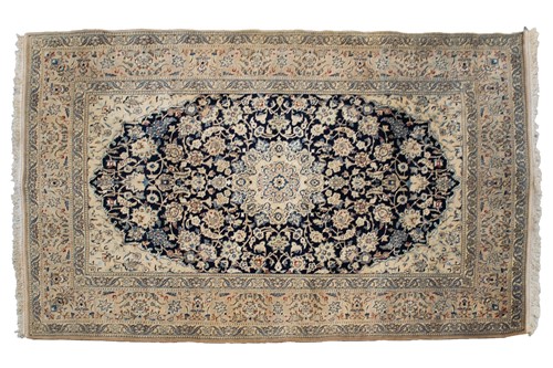 Lot 200 - A blue/ black ground Nain rug with a central...