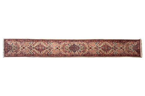 Lot 190 - An ivory ground Kerman runner with sprays of...