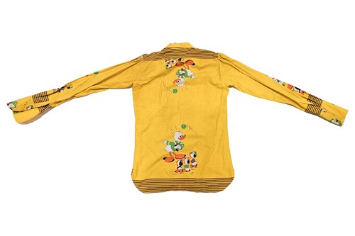 Lot 329 - A 1960s beagle-collared yellow shirt, from the...