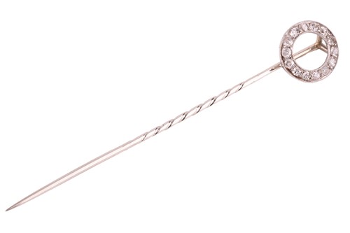 Lot 7 - A diamond-set open circle stick pin, the...