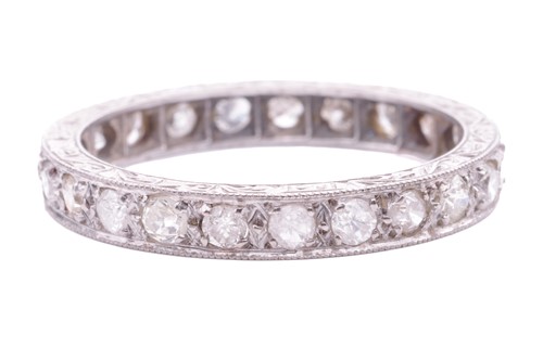 Lot 58 - A diamond eternity ring, grain set with twenty-...
