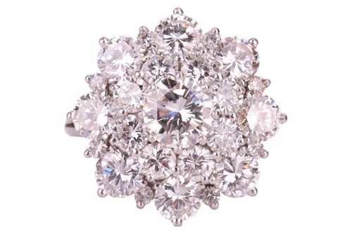 Lot 95 - A diamond cluster ring, set with round...