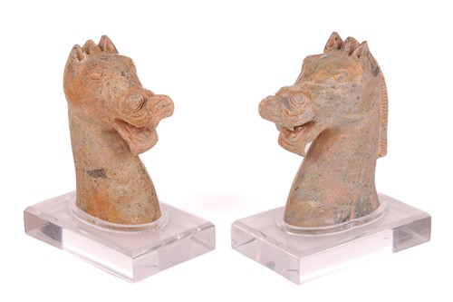 Lot 117 - A similar near pair of Chinese weathered green...