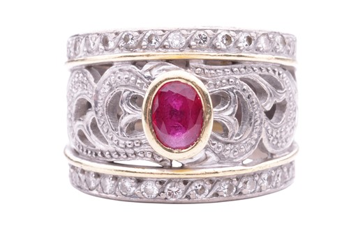 Lot 83 - A ruby and diamond dress ring, the bezelled...