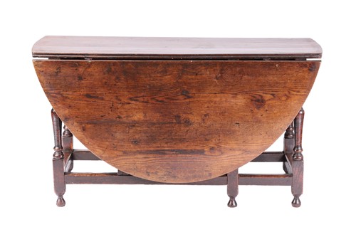 Lot 127 - A large late 17th-century oval oak gate table...