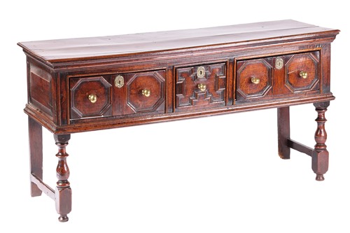 Lot 162 - A Charles II oak three-drawer dresser base...