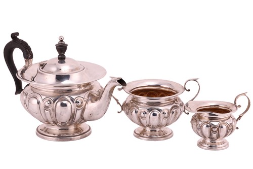 Lot 201 - An Edwardian three-piece silver tea service...