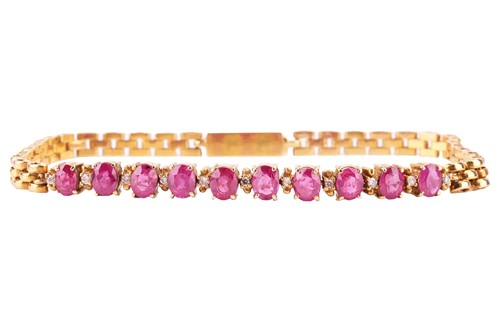 Lot 80 - A ruby and diamond line bracelet; composed of...