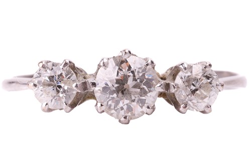 Lot 104 - A diamond three-stone ring, set with a row of...