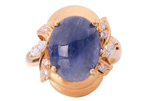 Lot 114 - A sapphire and diamond ring; the oval cabochon...