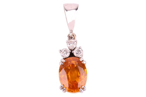 Lot 157 - An orange sapphire and diamond pendant, the...