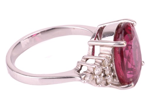 Lot 18 - A rubellite and diamond ring, the oval...