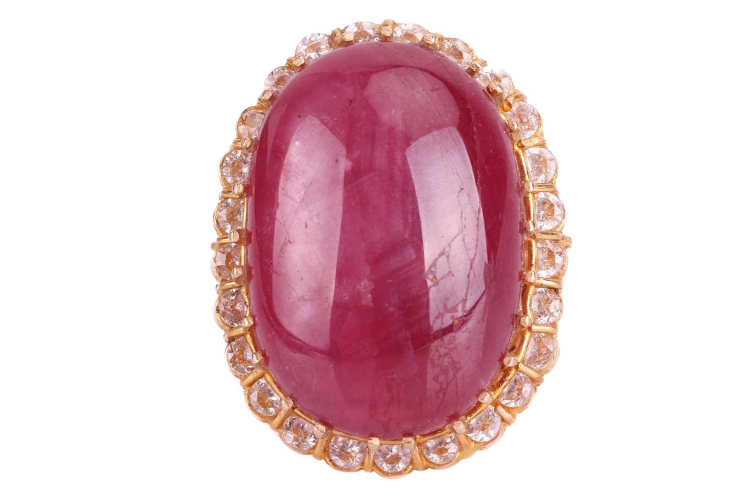 Lot 23 - A cabochon ruby and cubic zirconia cluster...
