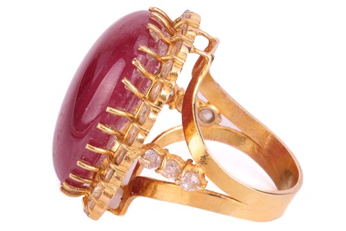 Lot 23 - A cabochon ruby and cubic zirconia cluster...