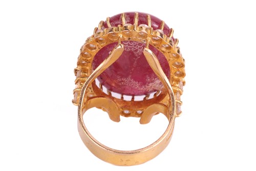 Lot 23 - A cabochon ruby and cubic zirconia cluster...