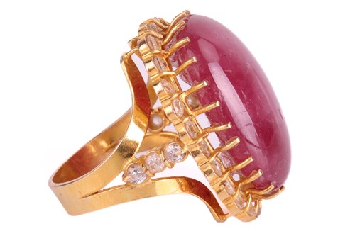 Lot 23 - A cabochon ruby and cubic zirconia cluster...