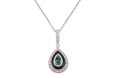 Lot 134 - A tsavorite garnet, onyx and diamond pendant,...