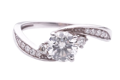 Lot 159 - A Diamond set crossover engagement ring,...