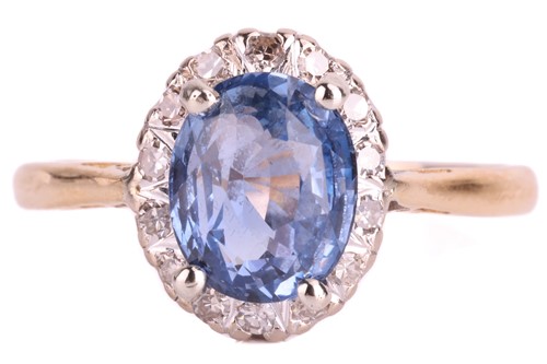 Lot 110 - A sapphire and diamond cluster ring, the...