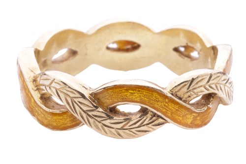 Lot 223 - A yellow guilloché enamel twist ring,...