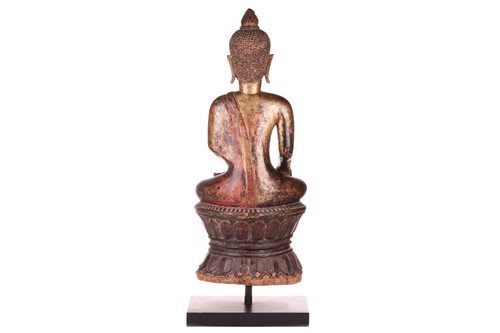 Lot 54 - A Siamese carved and giltwood, seated Buddha...