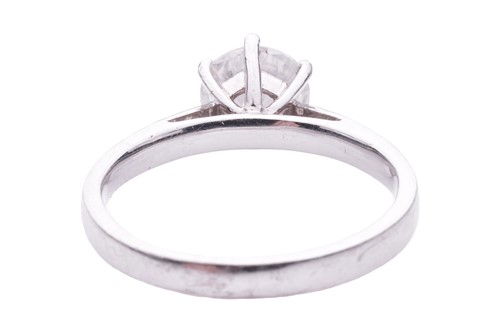 Lot 137 - A diamond solitaire ring in 18ct white gold,...