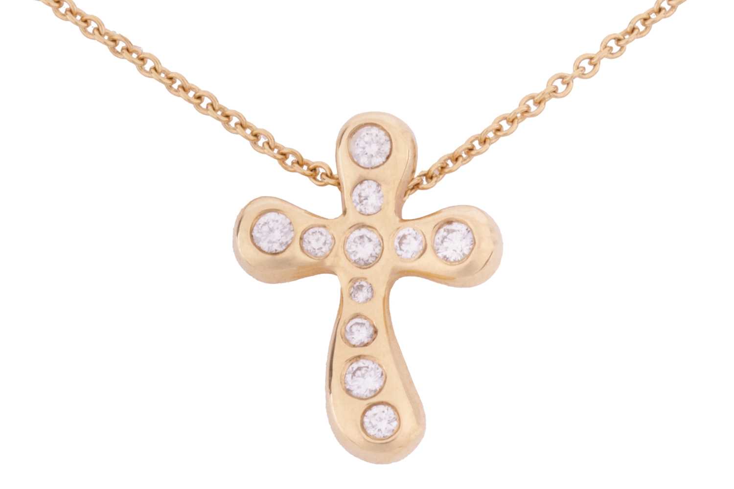 Lot 50 - A diamond set cross pendant and chain, by Elsa...