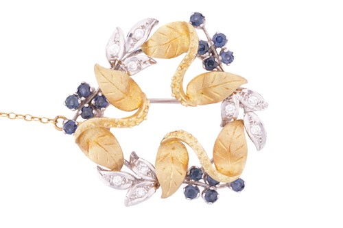 Lot 195 - A sapphire and diamond floral brooch designed...