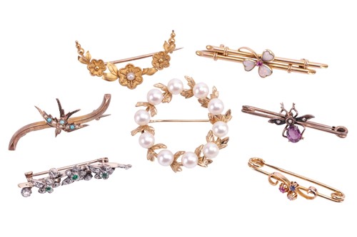 Lot 209 - A collection of seven brooches; including an...