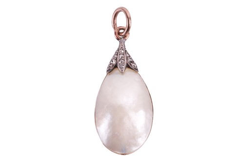 Lot 202 - A mabe pearl and diamond pendant, featuring a...