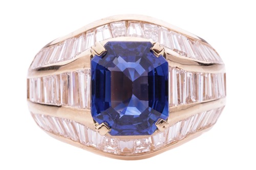 Lot 52 - A sapphire and diamond dress ring, the emerald...