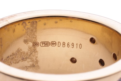 Lot 147 - De Beers - a diamond-set dress ring in 18ct...