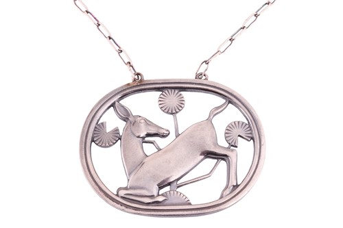 Lot 205 - Georg Jensen - a necklace with kneeling fawn...