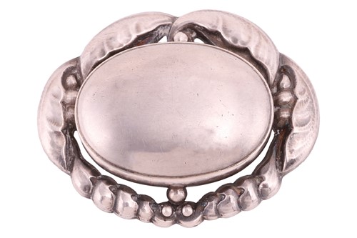 Lot 210 - Georg Jensen - an oval foliate brooch, centred...