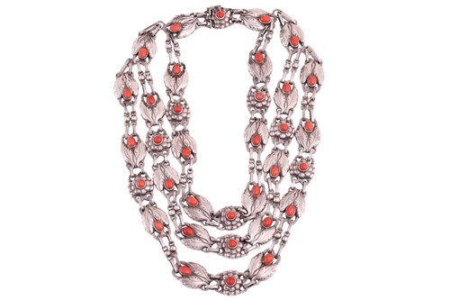 Lot 208 - Georg Jensen - a triple-strand floral necklace...