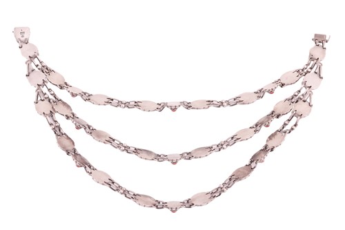 Lot 208 - Georg Jensen - a triple-strand floral necklace...