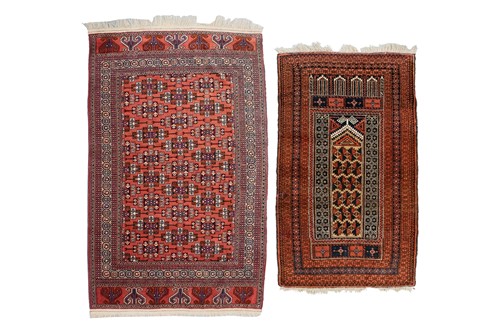 Lot 79 - A red ground Turkoman rug with rows of...