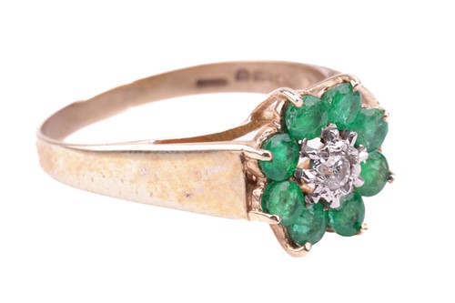 Lot 180 - An 18 carat gold, emerald and diamond set...