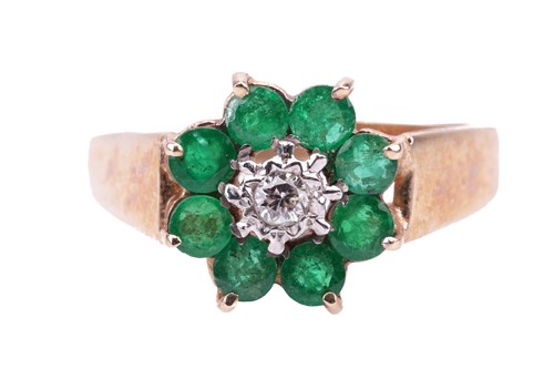Lot 180 - An 18 carat gold, emerald and diamond set...