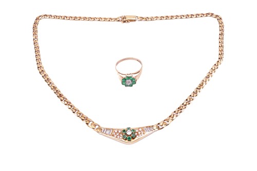 Lot 180 - An 18 carat gold, emerald and diamond set...
