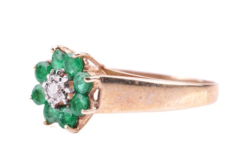 Lot 180 - An 18 carat gold, emerald and diamond set...