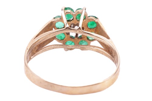 Lot 180 - An 18 carat gold, emerald and diamond set...