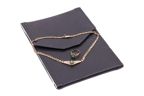 Lot 180 - An 18 carat gold, emerald and diamond set...
