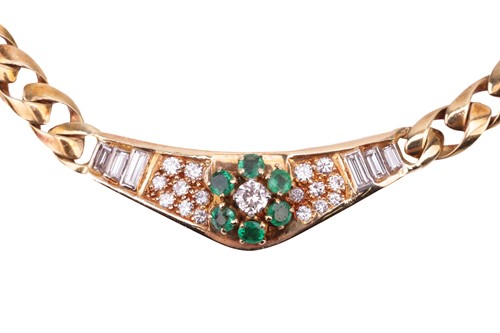 Lot 180 - An 18 carat gold, emerald and diamond set...