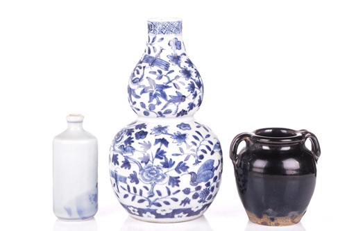 Lot 29 - A Chinese Henan black glazed small jar,...