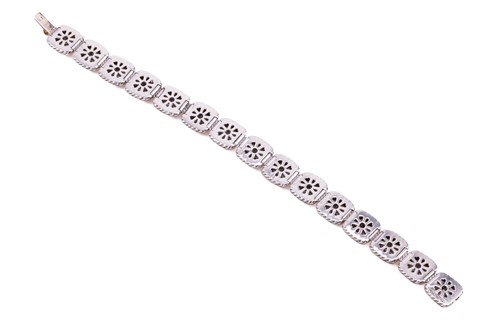 Lot 28 - A cushion-shaped link diamond set bracelet, in...