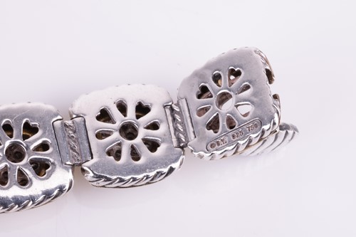 Lot 28 - A cushion-shaped link diamond set bracelet, in...